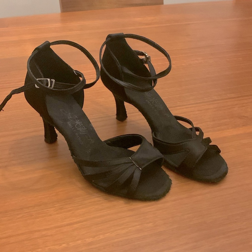 Latin dance heels just under 3 inches. Flexible, suede soles, satin fabric
